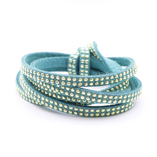 Achat au détail suédine cloutée 5x2mm turquoise avec strass dorés cordon suédine vendu au mètre